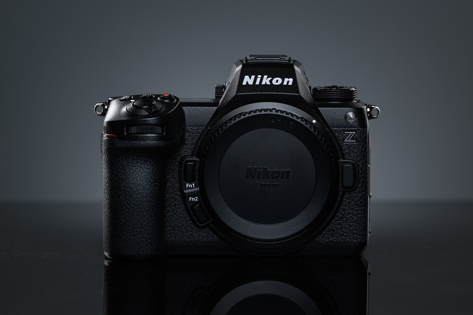 A Nikon Z6III camera body, front on, lit against a dark studio ground.